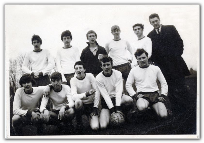 Barry holding ball with Football Team